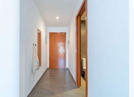 Modern apartment with communal swimming pool and parking space.10