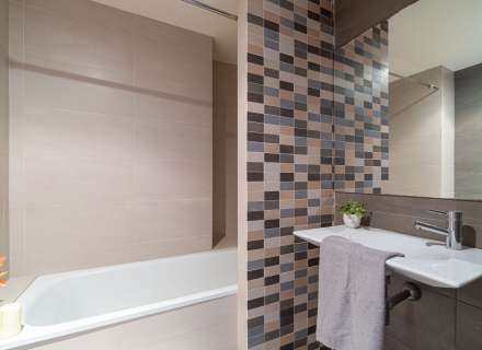 Modern apartment with communal swimming pool and parking space.11