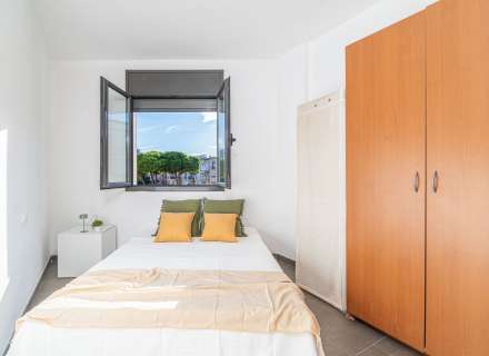 Modern apartment with communal swimming pool and parking space.14