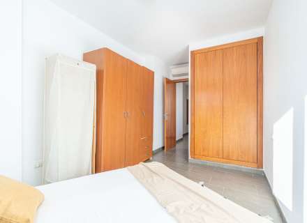 Modern apartment with communal swimming pool and parking space.15