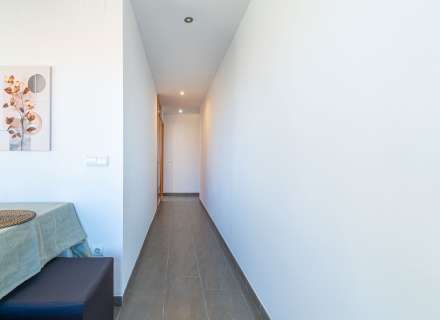 Modern apartment with communal swimming pool and parking space.17