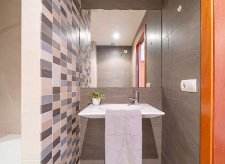 Modern apartment with communal swimming pool and parking space.13